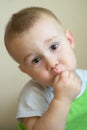 Funny little boy playing fool. Caucasian child 2 years old. Closeup portriat.