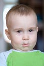 Funny little boy playing fool. Caucasian child 2 years old. Closeup portriat.