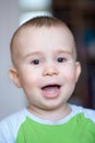 Funny little boy showing emotions, laughing. Caucasian child 2 years old. Closeup portriat.