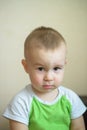 Funny little boy showing emotions, looking serious. Caucasian child 2 years old. Closeup portriat. Royalty Free Stock Photo