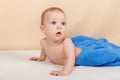 Funny little child boy is relaxing and smiling on the bed after shower Royalty Free Stock Photo