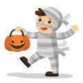 Funny little children in Mummy costume with pumpkin basket.