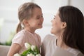 Funny little daughter have fun laughing greeting mom Royalty Free Stock Photo