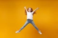 Funny little ginger kid girl 12-13 years old in white t-shirt isolated on yellow background. Childhood lifestyle concept Royalty Free Stock Photo