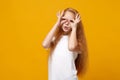 Funny little ginger kid girl 12-13 years old in white t-shirt isolated on yellow background. Childhood lifestyle concept Royalty Free Stock Photo