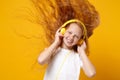 Funny little ginger kid girl 12-13 years old in white t-shirt isolated on yellow background. Childhood lifestyle concept Royalty Free Stock Photo