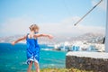Funny little girl with amazing view on Little Venice the most popular tourist area on Mykonos island Royalty Free Stock Photo