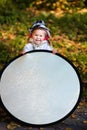 Funny little girl assist the photographer Royalty Free Stock Photo