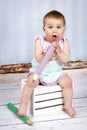 Funny little girl with big crayons Royalty Free Stock Photo