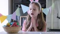 Funny little girl with bunny ears play Easter hunter at home Royalty Free Stock Photo