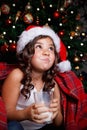 Funny little girl drinking a glass of milk Royalty Free Stock Photo