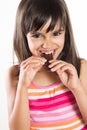 Funny little girl eating chocolate Royalty Free Stock Photo