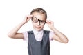 Funny little girl in glasses makes faces Royalty Free Stock Photo