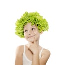 Funny little girl with green lettuce hair looking up