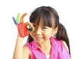 Funny little girl with hands painted in colorful paint
