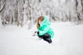 Funny little girl having fun in beautiful winter park Royalty Free Stock Photo