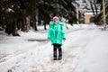 Funny little girl having fun in beautiful winter park Royalty Free Stock Photo