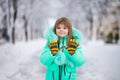 Funny little girl having fun in beautiful winter park Royalty Free Stock Photo