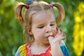 Funny little girl in the park Royalty Free Stock Photo