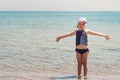 Funny little girl playing on the beach. Royalty Free Stock Photo