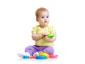 Funny little girl playing with cup toys Royalty Free Stock Photo