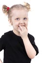 Funny little girl put her fingers in her mouth Royalty Free Stock Photo