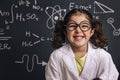 Funny little girl science student in lab coat
