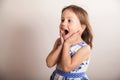 Funny little girl screaming aloud Royalty Free Stock Photo