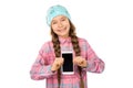 Funny little girl showing smart phone with blank screen on white background. Playing Games and watch video. Royalty Free Stock Photo