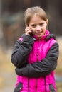 Funny little girl talking on the phone Royalty Free Stock Photo