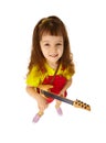 Funny little girl with toy guitar on white Royalty Free Stock Photo