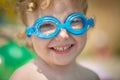 Funny little girl in water glasses Royalty Free Stock Photo
