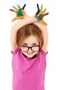 Funny little girl wearing glasses playing with water colors Royalty Free Stock Photo