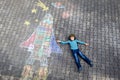 Little kid boy flying by a space shuttle chalks picture Royalty Free Stock Photo