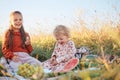 Funny little kids eating watermelon on green grass on nature at summer day. Brother and sister outdoors. Toddler Boy and Baby Girl Royalty Free Stock Photo