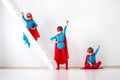 Funny little Kids power super hero. Royalty Free Stock Photo