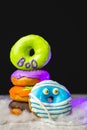 Funny little monster donut for halloween bright colors with little eyes Royalty Free Stock Photo