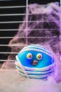 Funny little monster donut for halloween bright colors with little eyes Royalty Free Stock Photo