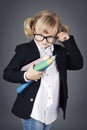 Funny little nerd holding big coloring pencils Royalty Free Stock Photo