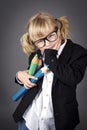 Funny little nerd holding big coloring pencils Royalty Free Stock Photo