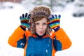 Happy kid boy having fun with snow in winter Royalty Free Stock Photo