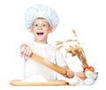 Funny little scullion is kneading dough Royalty Free Stock Photo