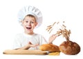 Funny little scullion is kneading dough Royalty Free Stock Photo