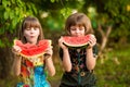 Funny little sisters girl eat watermelon in summer Royalty Free Stock Photo