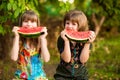 Funny little sisters girl eat watermelon in summer Royalty Free Stock Photo