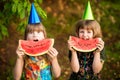 Funny little sisters girl eat watermelon in summer Royalty Free Stock Photo