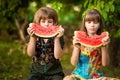 Funny little sisters girl eat watermelon in summer Royalty Free Stock Photo