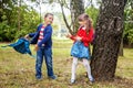 Funny little students go to school. Children play in the park. T Royalty Free Stock Photo