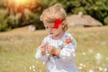 Funny little Ukrainian Caucasian girl in a shirt with embroidery playing in nature Royalty Free Stock Photo