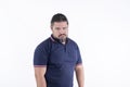 A funny looking burly man in his 30s frowning. Disappointed but looking silly. Isolated on a white backdrop Royalty Free Stock Photo